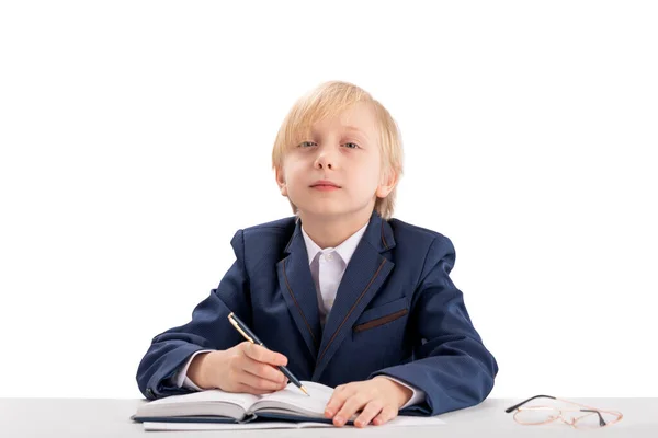 Child Boss Sits Table Writes Notebook Diligent Student Writes Copybook — Stok fotoğraf