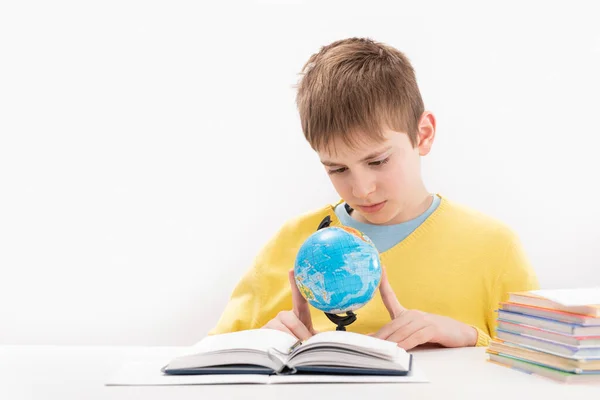 Boy Yellow Jumper Does Geography Lessons Schoolboy Sits Table Carefully — Stockfoto