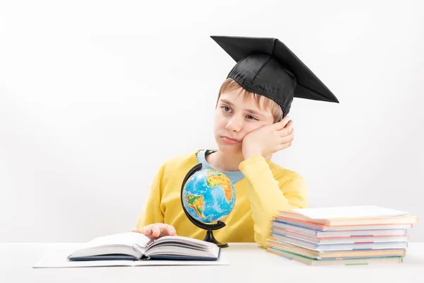 Bored Elementary School Boy Listens Teacher Boy Students Hat Notebook — Zdjęcie stockowe