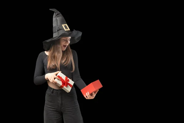 Young Girl Black Clothes Pointed Hat Holds Open Gift Looks — Foto Stock