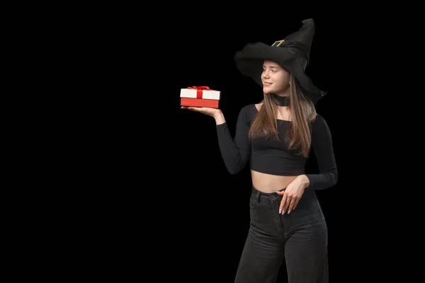 Girl Pointy Hat Holds Gift Her Hands Isolation Black Background — ストック写真