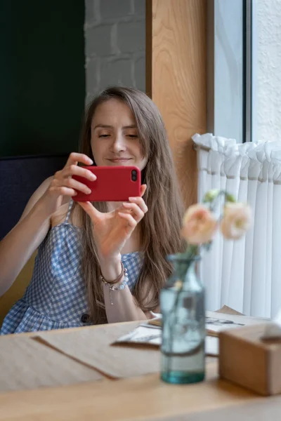 Beautiful Young Woman Cafe Holds Phone Hands Smiles Cute Girl — Stock Photo, Image