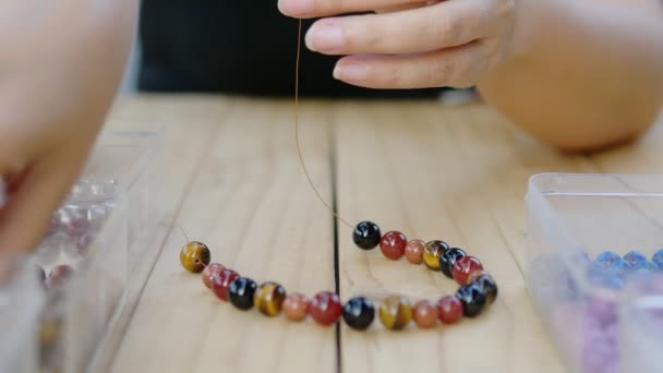 Lady Making Beats Necklace — Stock Video