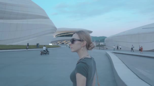 Blond Hair Walking Modern Architecture Style Buildings Footage — Stockvideo