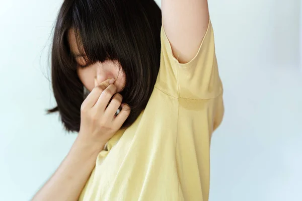 Woman Yellow Shirt Covered Her Nose Her Hands Because She — Stock Photo, Image