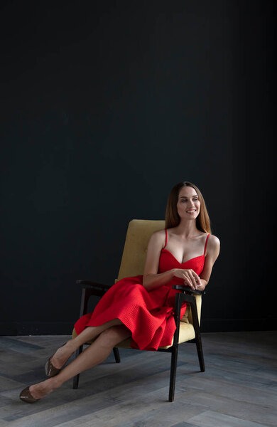 Portrait Beautiful Young Woman Sitting Chair Red Dress Dark Background Stock Photo