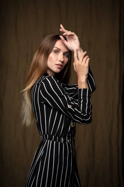 Young Woman Black White Striped Dress Looking Camera Posing Studio — Stock Photo, Image