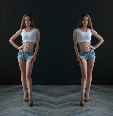 mirrored shot of slim blonde young woman wearing top and shorts posing on dark background