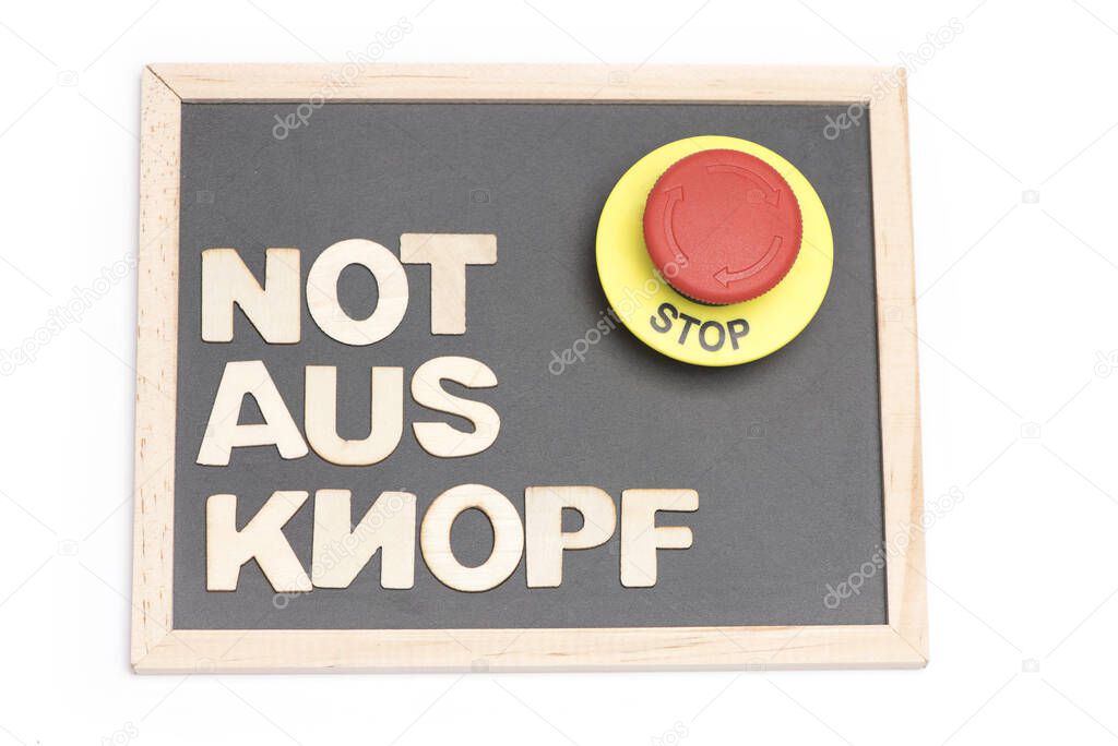 small black chalkboard with wooden letters showing the German words not aus knopf and an emergency stop button on white background as concept for end and pause