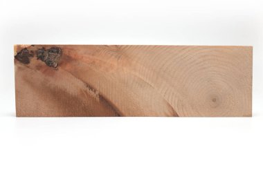 Close up of rectangular piece of pine wood on white background