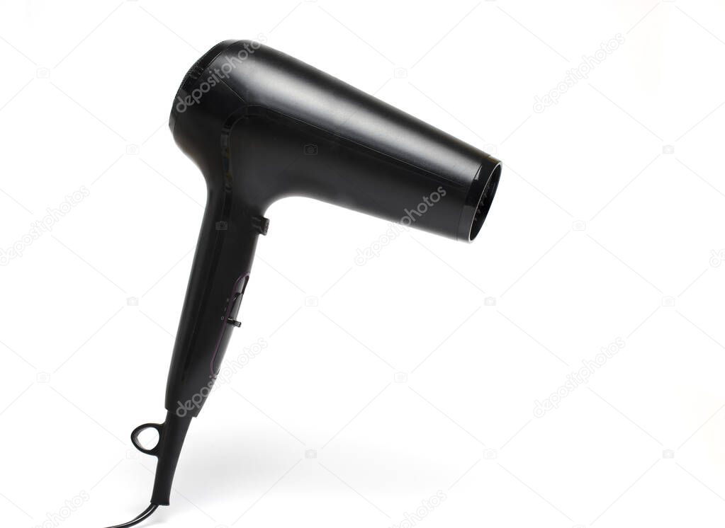 Close up of modern black hair dryer on white background