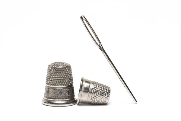 Close Sewing Needle Next Two Different Size Thimbles White Background — Φωτογραφία Αρχείου
