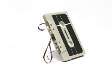Close up of an analog music cassette from the eighties and nineties on white background concept for old hits and retro music and technology