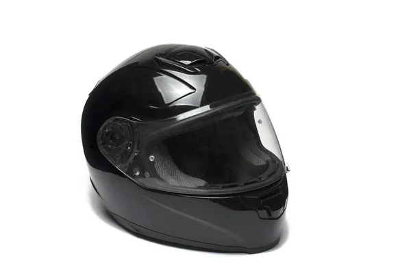 黑色全脸面罩摩托车头盔的近视侧视图及白色背景上的密闭保护玻璃 图库图片
