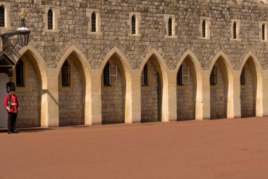 Partial view Windsor castle with portico guard house and soldier of the Royal Guard