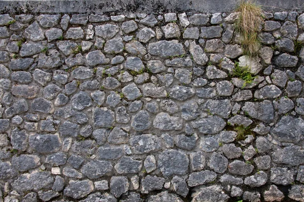 Vista Perto Parcial Uma Parede Pedra Antiga Feita Pedras Simples — Fotografia de Stock