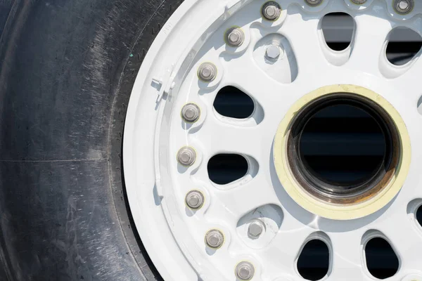 Partial view close up of jumbo jet aviation aircraft tire of landing gear