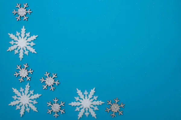 Christmass lapos fehér hópelyhek alakú keret — Stock Fotó