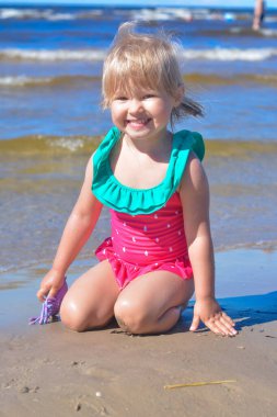 Girl of European appearance having fun on the beach 