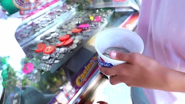 Teenager Holds Lot Coins Coin Pusher Machine Take Game Amusement — Stock Video