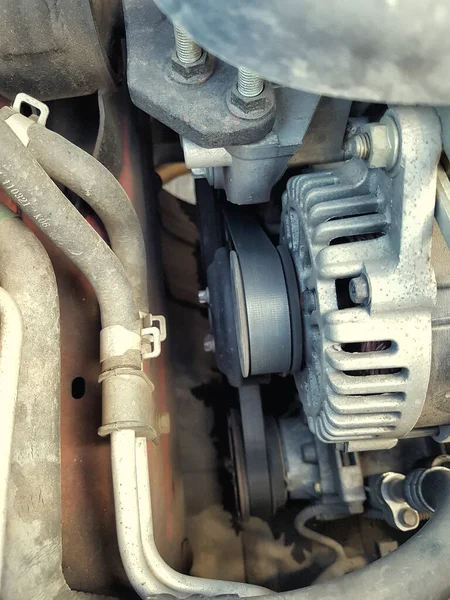 Timing belt along a car engine. Car servicing, Car inspection. Car maintenance, servicing. High quality photo