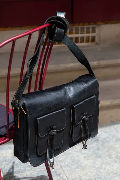 Close-up photo of black leather bag corporate. — Stock Photo, Image