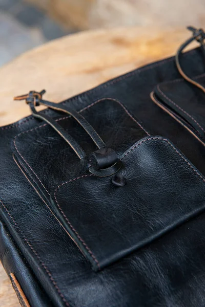 Close-up photo of black leather bag corporate. — Stock Photo, Image