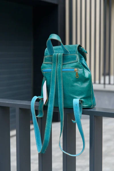 Tiffany leather backpack on the metal fence — Stock Photo, Image