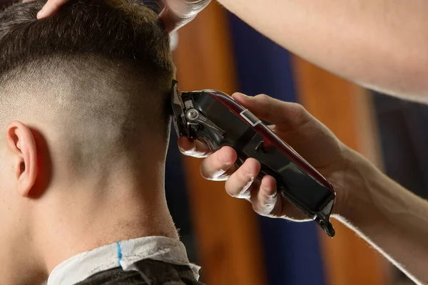 Close up of hair clipper. Person getting a haircut — Stock Photo, Image