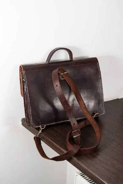 Back view of a brown leather briefcase with antique and retro look for man — Stock Photo, Image