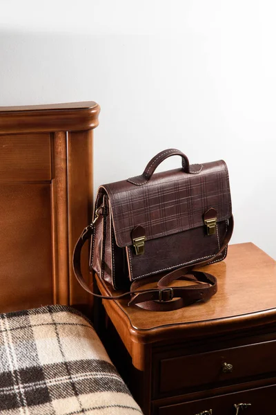 Brown leather briefcase with two locks. hotel room photo — Stock Photo, Image