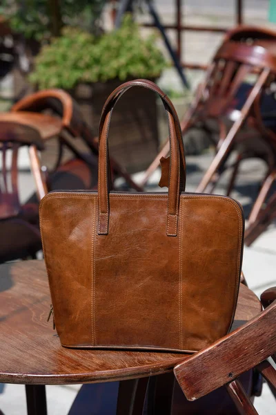 Close Photo Brown Leather Bag Wooden Table Outdoors Photo — Photo
