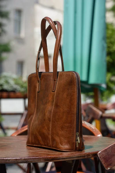 Close Photo Brown Leather Bag Wooden Table Outdoors Photo — Stock Photo, Image