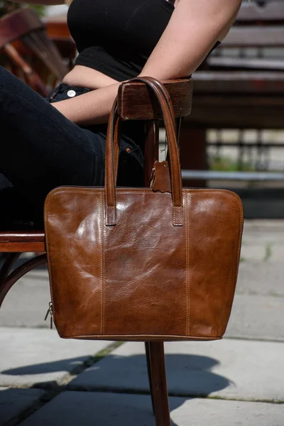 Close Photo Brown Leather Bag Wooden Chair Outdoors Photo — Stock Photo, Image