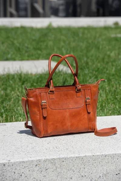 Close Photo Luxury Orange Leather Bag White Marble Outdoors Photo — Stock Photo, Image