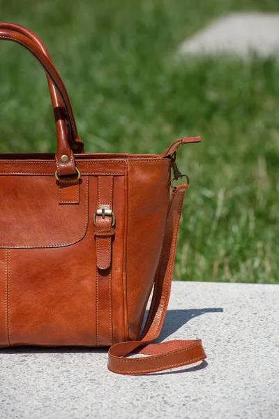 Close Part Photo Luxury Orange Leather Bag White Marble Outdoors — Stockfoto