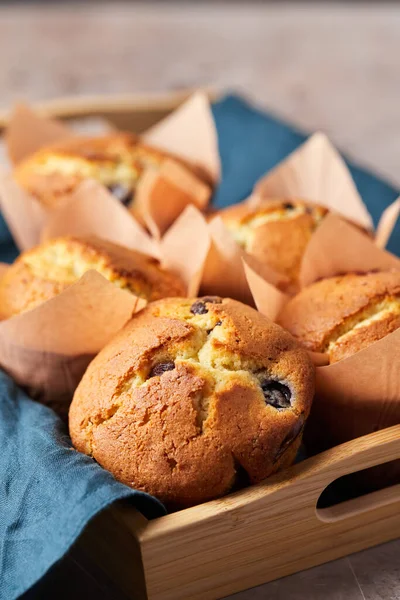 A group of muffins with berries and chocolate on a tray. — Φωτογραφία Αρχείου