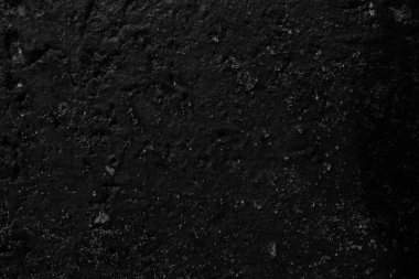 Siyah beton ya da pürüzlü yol yüzeyi duvar kağıdı olarak kullanılabilir, serin ve şık görünür..