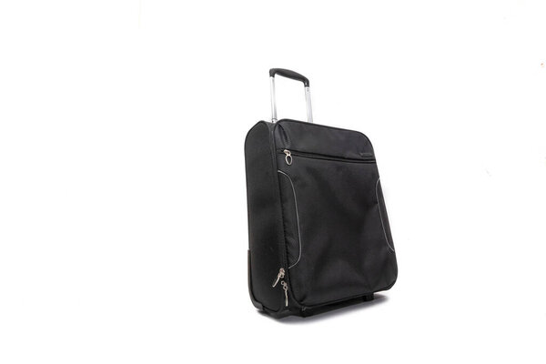 A black trolley bag. Isolated on white background. Vacation concept.
