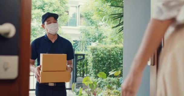 Young Asian Delivery Man Wear Mask Blue Navy Uniform Carry — Stockvideo