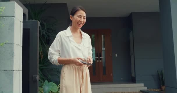 Young Happy Asian Woman Accept Paper Bag Delivery Man Bicycle — Stock Video