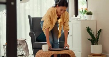 Youth asia female girl or university student stand front sofa chair put computer laptop on table feel pain, hurt in back from hard work in living room at home. Office syndrome, Life balance concept.