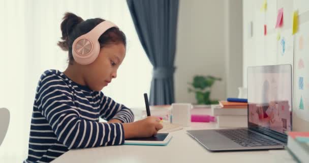Asian Toddler Girl Sweater Wear Headphone Sit Front Desk Notepad — 图库视频影像