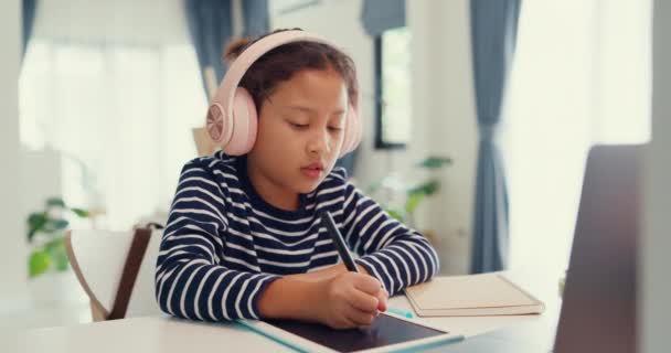 Asian Toddler Girl Sweater Wear Headphone Sit Front Desk Notepad — Vídeo de Stock