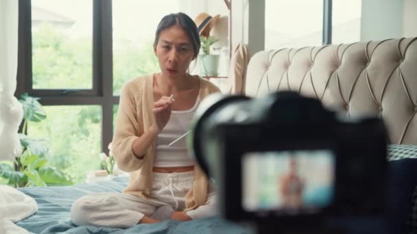 Close Happy Asian Girl Influencer White Cream Pajamas Recording Sharing — Stock Video
