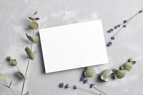 Greeting or wedding invitation card mockup with dry lavender and eucalyptus flowers — Stockfoto