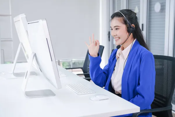 beautiful asia woman working call center operator with headset in office or workplace