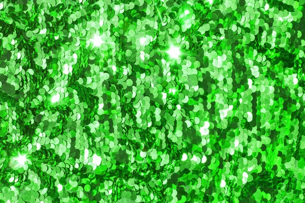 Achtergrond, bezaaid met groene pailletten, glitter pailletten groen — Stockfoto