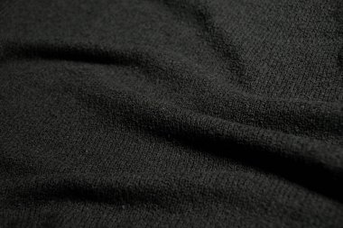 Yumuşak dalgalı ve pürüzsüz siyah kumaş dokusu