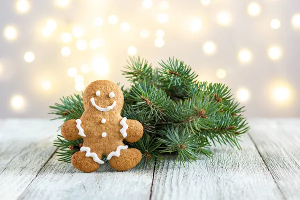 Gingerbread Man Fir Tree Branch Bokeh Lights Background Festive Xmas — Stock Photo, Image